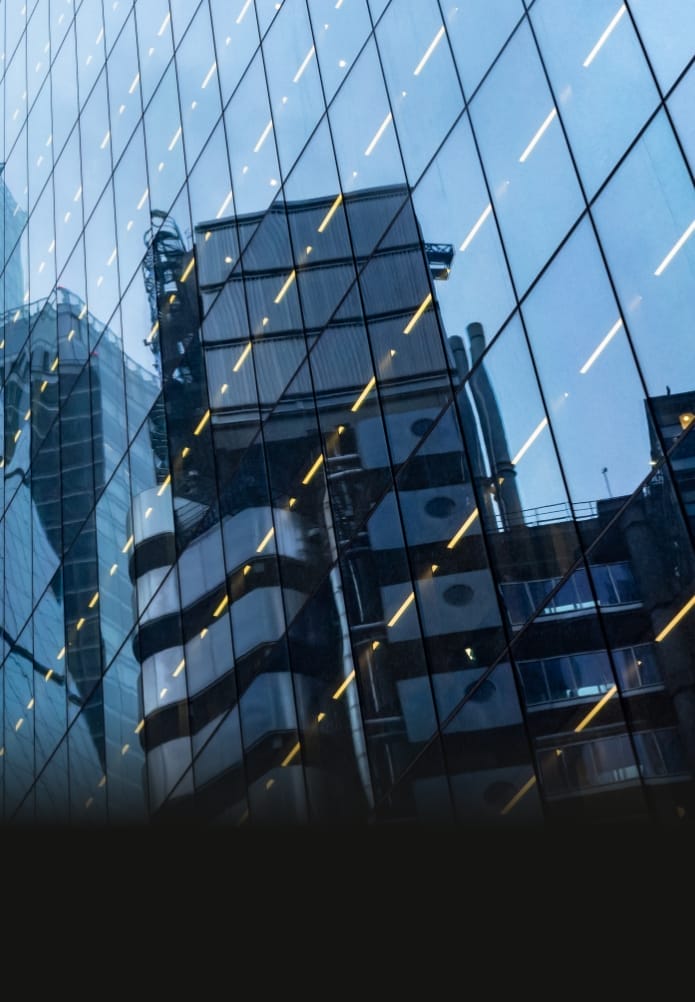 Modern abstract reflections in glass fronted commercial office buildings in the financial district of the British capital London.