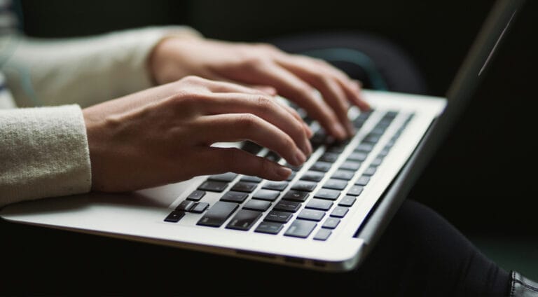 Person who types on a computer keyboard